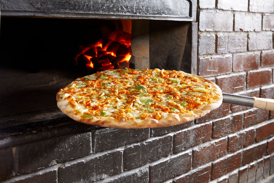 Buffalo Chicken Pizza coming out of oven